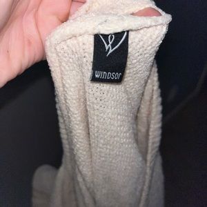 Cream Windsor open back sweater.